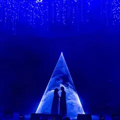 For a Sangeet night that was truly written in the stars, I created this dramatic silhouette moment. Using a cosmic projection against a deep blue backdrop, this design element transformed a performance into a celestial event, capturing the couple's love story in a single, powerful image.