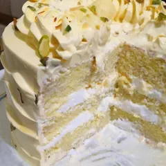 The best part of the Rasmalai cake is the inside. Here you can see the layers of soft, saffron-infused sponge and creamy rasmalai filling. It's an indulgent treat that combines the best of both worlds.
