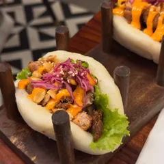 A photo of delicious bao buns from a reunion with a dear friend. I often weave personal stories about friendship and life into my food posts.