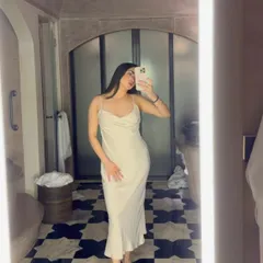 A throwback to my trip to Jaipur. This mirror selfie in a beautiful white satin dress captures the aesthetic of the city's stunning architecture, a perfect blend of personal style and travel content.