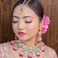 A beautiful pink meena Polki set, available for sale. This includes the necklace, earrings, and tika.