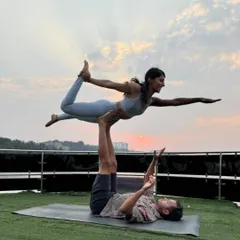 Another angle of our yacht Acro Yoga session, this time with the sunset in the background. The balance of strength and surrender is what makes this practice so special.