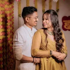 A happy Haldi ceremony. The makeup is minimal and radiant, letting the bride's natural glow and happiness shine through.