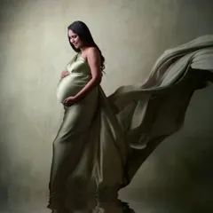 I love playing with creative effects to enhance a portrait. Here, a flowing satin gown and a digitally added water reflection create a serene and artistic image.