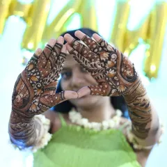 A creative pose showing off the intricate details of the bridal mehndi. I love when my clients have fun with their henna.