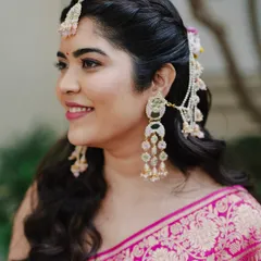 A close-up of Reeya's fresh matte glam for her Haldi ceremony. We used subtle pink hues and paired them with handcrafted jewels for a look that was pure magic.