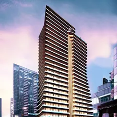A street-level rendering of the Embrace Tower, illustrating how its contemporary architecture integrates into the urban fabric. The flowing curves of the facade create a dynamic visual that changes with the light.