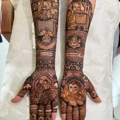 A story of a royal wedding procession. This design features the bride's entry, the groom on an elephant, the Gathbandhan ceremony, and a portrait of Lord Ganesha for blessings.