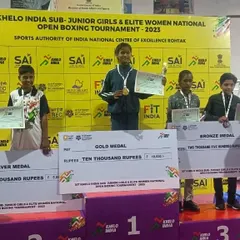 Victory at the Khelo India Sub-Junior Girls & Elite Women National Open Boxing Tournament. My student stands on the first place podium with her gold medal, certificate, and prize money.