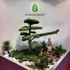 I love designing tranquil corners like this Zen garden. By combining a sculpted Podocarpus bonsai with a serene Buddha statue and natural elements, I can create a pocket of peace and mindfulness for your home or office.