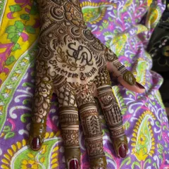 Another view of Alina's personalized henna, showing how the names and initials are beautifully integrated into the overall design.