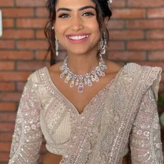 All things glow, grace, and glamour. This reception look features soft eyes, radiant skin, and a showstopper vibe.