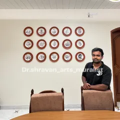 Here I am with a completed custom plate art installation. This project was a blast, telling a story across 15 individual hand-painted plates. It's a truly unique way to personalize a dining space and a great conversation starter for guests.