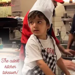 The cutest kitchen takeover. This little one, all geared up in his apron, is ready to learn the secrets of pizza making.