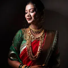A dramatic bridal portrait using focused light to highlight the bride's beautiful features and traditional jewelry.