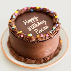 Nothing beats the timeless joy of a simple, classic chocolate cake for a birthday. This one is rich, moist, and decorated with fun, colorful sprinkles.
