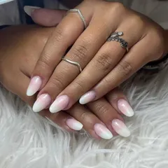 This beautiful ombré set on almond-shaped nails is always a classy choice. The gradual fade from pink to white is subtle and elegant.