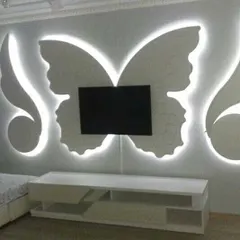 I can bring any creative idea to life, like this custom butterfly-shaped TV unit. Built from gypsum and backlit with LEDs, it turns a functional area into a piece of art.