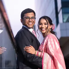 A beautiful couple portrait from a reception. I gave the bride a romantic, soft glam look with a pink lip and a floral hair accessory that complements her saree.