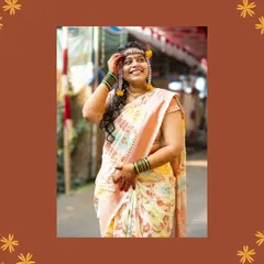 A full-length portrait of the bride during her Haldi. Capturing her in the outdoor setting of her home in Raigad adds a personal touch. Her expression of looking up with a smile is a beautiful, candid moment of hope and happiness.