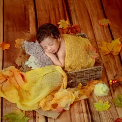 Like autumn leaves, they remind us how beautiful change can be. This simple setup with a basket and scattered fall-colored fabrics is a lovely, artistic take on a seasonal theme.