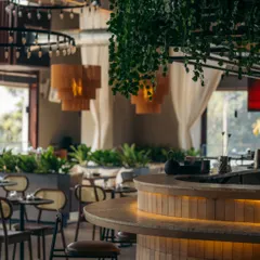 At Prequel, soft under-bar lighting highlights the texture of the tiles and creates a warm, inviting glow. This subtle detail elevates the bar into a sophisticated focal point, especially as evening sets in.