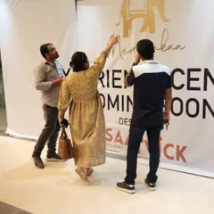 Collaboration is key to a successful project. Here, I am on-site with the team, reviewing the progress of the "Coming Soon" branding and ensuring every detail aligns with the overall design intent for the experience centre.