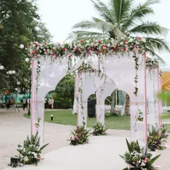 Your wedding journey begins with the first step inside. I designed this elegant entrance with modern arches, sheer drapes, and cascading florals to give guests a breathtaking welcome.