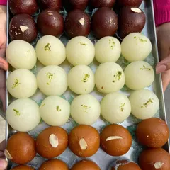 A beautiful tray showcasing different types of Gulab Jamun and Rasgulla. I make sure each one is soft, spongy, and perfectly sweet, just like it should be.