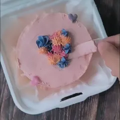 See how the magic happens with this hidden message cake. This video reveals the pull-tab mechanism that uncovers a secret anniversary message hidden beneath the frosting.