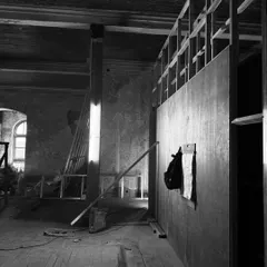 A moment of quiet contemplation on a new site. The interplay of light, shadow, and raw materials is where the story of a building begins. My process starts here, by listening to what the space has to say.
