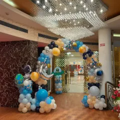 Blast off into an unforgettable celebration with our space-themed balloon arch. This grand entrance, complete with astronaut and rocket ship foil balloons, sets the stage for an out-of-this-world party adventure.