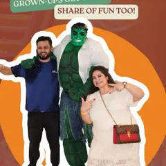 At Wooray Elite, grown-ups get their share of fun too. Here, guests are seen enjoying a moment with the Hulk mascot, showing that the fun is truly for all ages.
