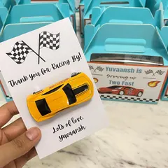 It's all in the details. For a "Two Fast" themed second birthday, we created these custom "Thank you for Racing By" return favours, complete with a toy car for each little guest.