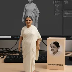 This figurine represents Smt. Sitadevi Ji (1912-2008), affectionately known as Mother. She challenged the notion that yoga was only for men and authored the first book on yoga for women.
