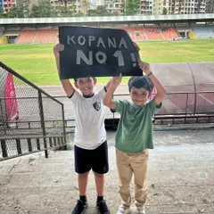 True believers and our biggest supporters. Two young members of the Kopana family cheer on their team, showcasing the incredible community spirit at our club.