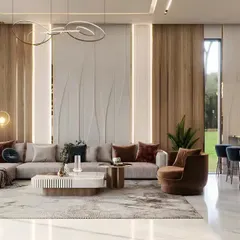 We designed this expansive living area with an open-concept layout, perfect for modern lifestyles. The space features a large sectional sofa, elegant wall paneling with integrated lighting, and a seamless flow into the dining and bar area.