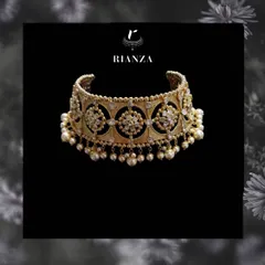 A detailed look at the Rajwadi choker. The piece is handcrafted with intricate metalwork, polki-style stones, and delicate pearl drops, reflecting royal Rajasthani aesthetics.