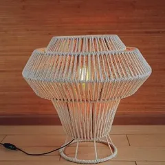 This large, stylish macrame table lamp is perfect for making a statement. The wrapped cord design is modern yet rustic, and it gives off a beautiful, warm glow.