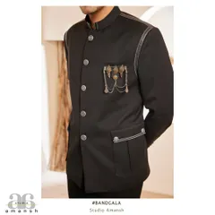 A focused view on the torso, showing the placement of the custom embellishments and the contrast of the silver buttons against the black fabric.