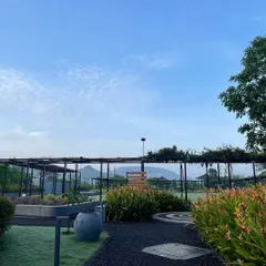 The serene landscape of our retreat venue, with mountains in the distance. Nature provides the perfect backdrop for deep inner work and connection.