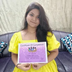 A proud moment for a student who has just completed the Professional Diploma Nail Art course. This certification marks her entry into the professional nail industry.