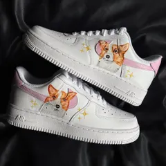 A pair of custom sneakers with a cute Corgi portrait, complete with pink accents and sparkles.