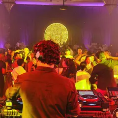 My perspective from the DJ booth, looking out at a full dance floor. My goal is to create a space where people can leave their worries behind and get lost in the music.