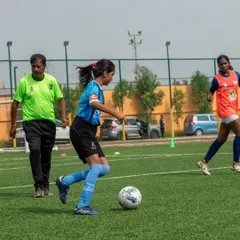 Development is in our DNA. Here, one of our players hones her dribbling skills under the watchful eye of an AIFF certified coach, showcasing the professional, hands-on training every player receives.