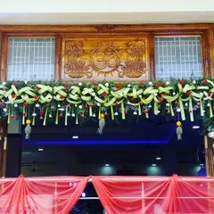 This detailed shot of the entrance decor highlights the intricate weaving and floral work. It’s a perfect example of how I blend traditional craftsmanship with elegant design to honor your heritage.