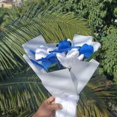 A side view of the custom bouquet, tied with a lovely white ribbon.