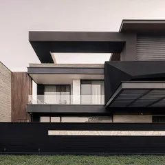 A closer view of the Carbonado residence, highlighting the interplay of textures and geometric forms. The design balances robust, dark masses with transparent glass and warm wooden accents for a sophisticated, modern facade.