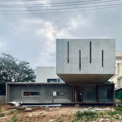 The Long House under construction, with its 23-foot cantilevered concrete box fully formed. This image captures the project at a critical structural milestone.