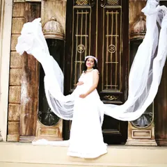 This shot showcases the dramatic flying trail of my white maternity gown, creating a stunning, ethereal effect for a memorable pregnancy photoshoot.